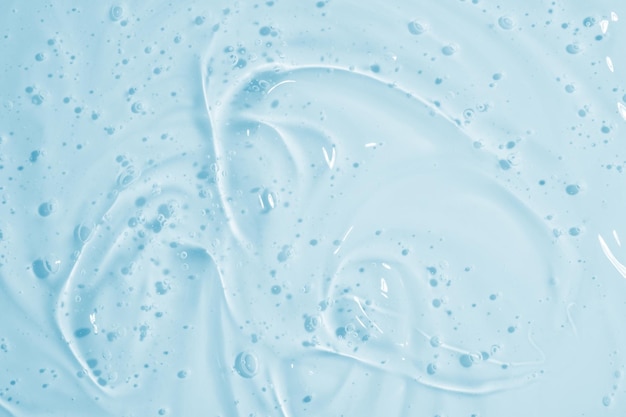 Photo fond de crème de soin liquide de texture de sérum de gel clair
