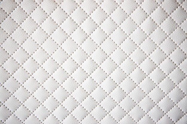 Photo fond de cuir blanc original intéressant avec un motif de quilting