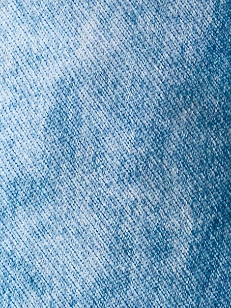 Un fond denim bleu avec une texture rugueuse.