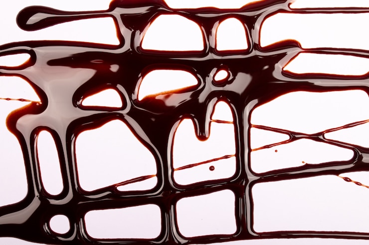 Photo fond d'éclaboussures et de gouttes de chocolat