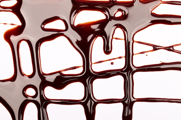 Photo fond d'éclaboussures et de gouttes de chocolat