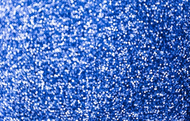 Photo fond étincelant bleu glamour. arrière-plan flou de paillettes. concept festif de vacances.