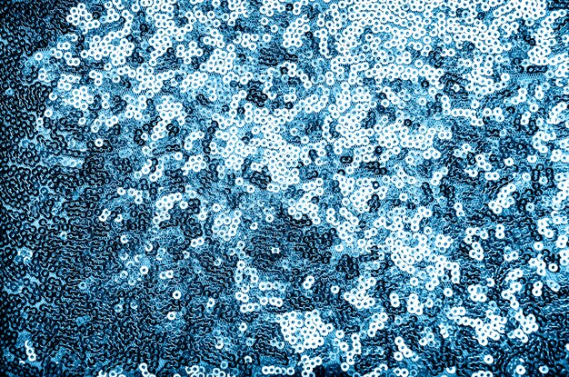 Fond festif fait de paillettes bleues