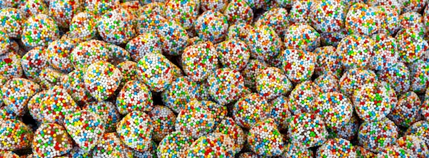 Fond de fête de bonbons multicolores