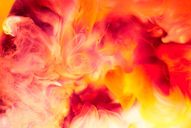 Photo fond de feu rouge jaune liquide abstrait. passion, amour sensuel sexuel. concept de la saint-valentin, fumée tourbillonnante