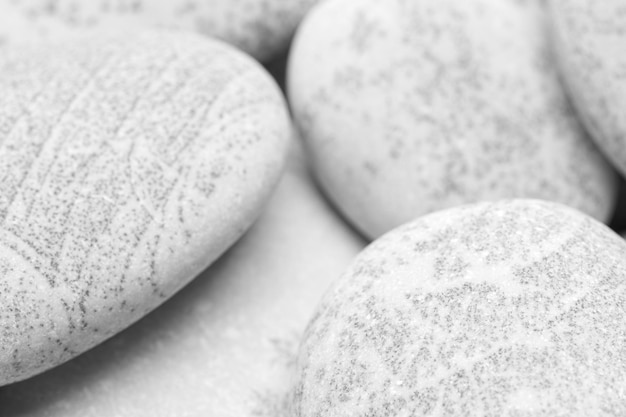 Fond de galets fond abstrait avec des pierres de reeble gris rond sec gros plan gris fond de cailloux concept de relaxation spa