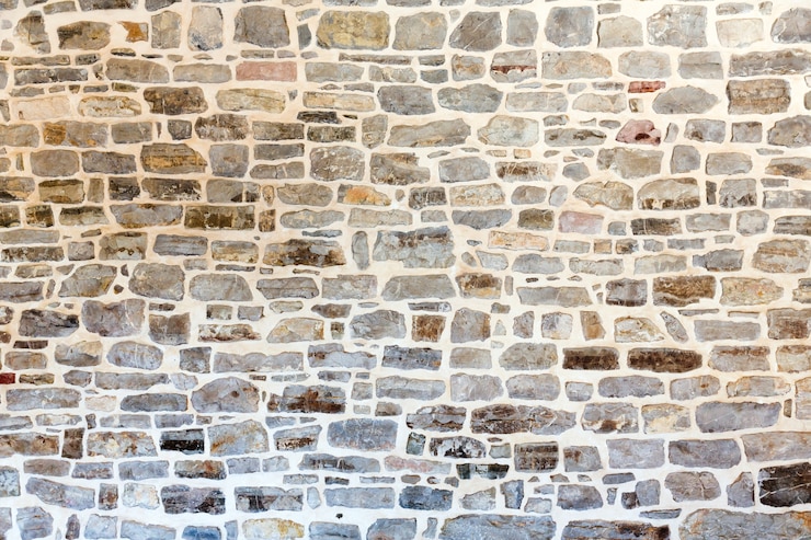 Photo fond de grand mur de pierre sombre