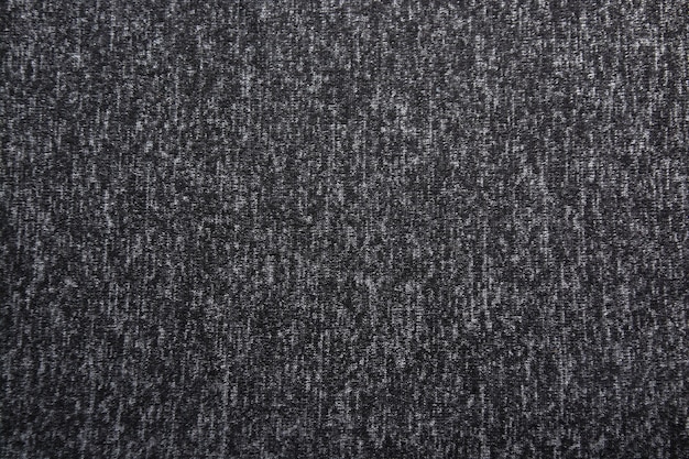 Fond gris foncé dégradé avec texture textile.