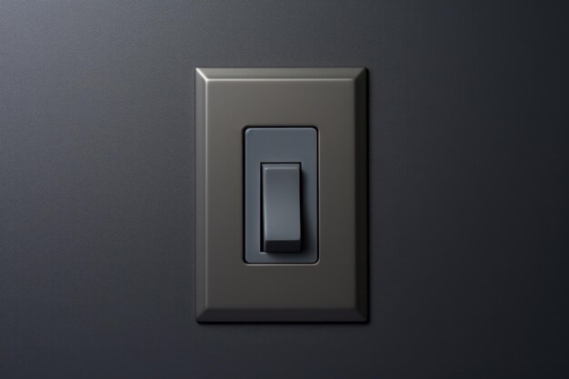 Un fond gris avec un interrupteur de lumière noir