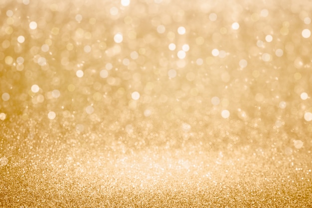 Fond de lumières de paillettes d'or et de bokeh