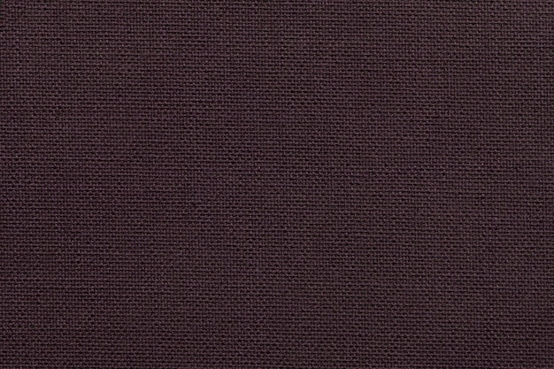 Fond marron foncé d'un matériau textile