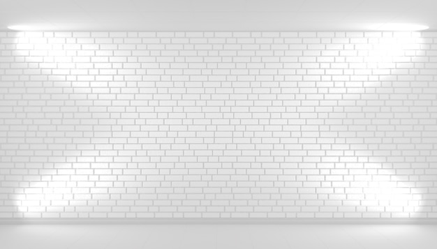 Fond de mur de brique blanche avec espace libre éclairé par des projecteurs