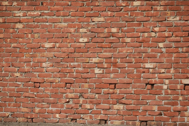 Fond de mur de brique de couleur rouge