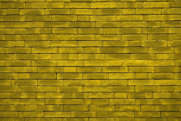 Fond de mur de brique jaune