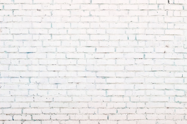 Fond de mur de brique peint en blanc