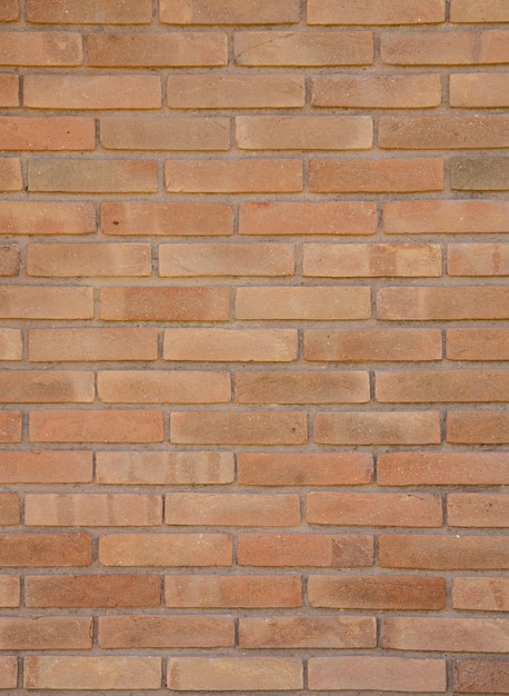 Fond de mur de briques d'argile orange