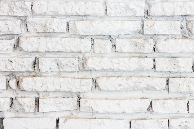 Fond de mur de briques blanches.