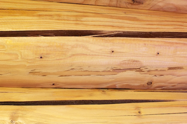 Un fond de mur de cabane en rondins