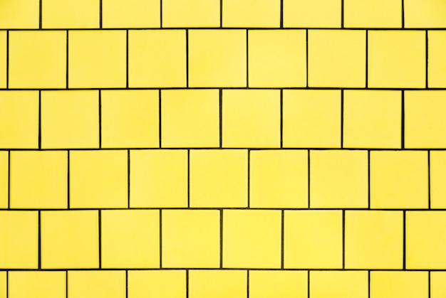 Fond de mur de carreaux jaune