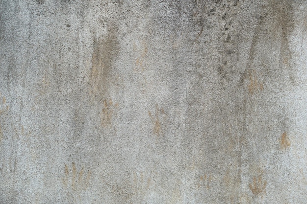 Fond de mur de ciment avec des taches de peinture