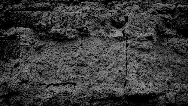 Fond de mur fissuré grunge noir foncé