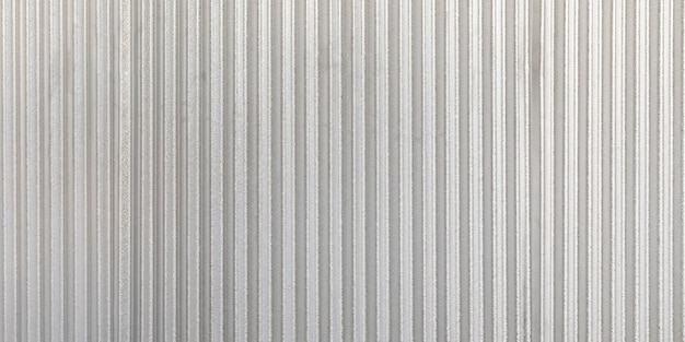 Photo le fond de mur de panorama en métal gris ondulé. texture et arrière-plan grunge zinc rouillé.