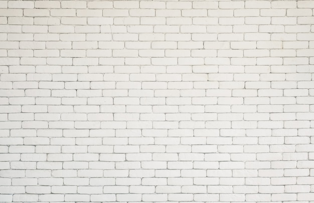 Fond de mur de papier peint de bureau à domicile de texture de brique blanche.