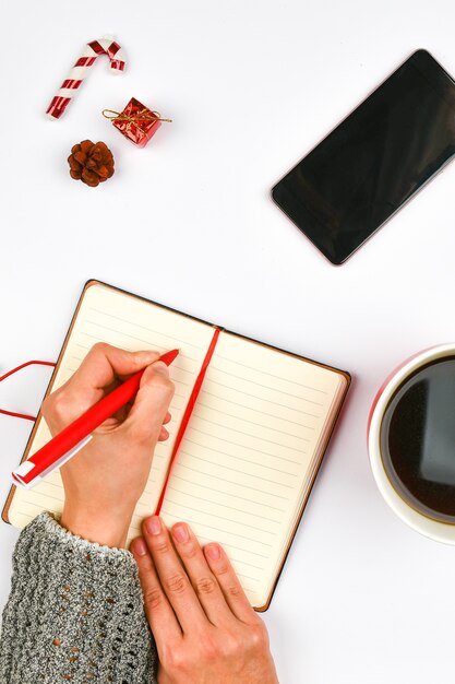 Fond de Noël du bloc-notes, téléphone, tasse de café