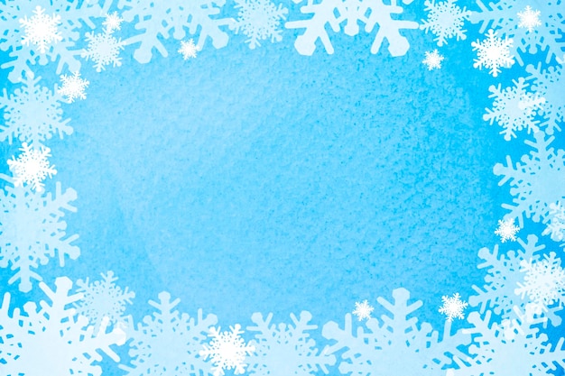 Fond de Noël avec des flocons de neige sur une texture aquarelle