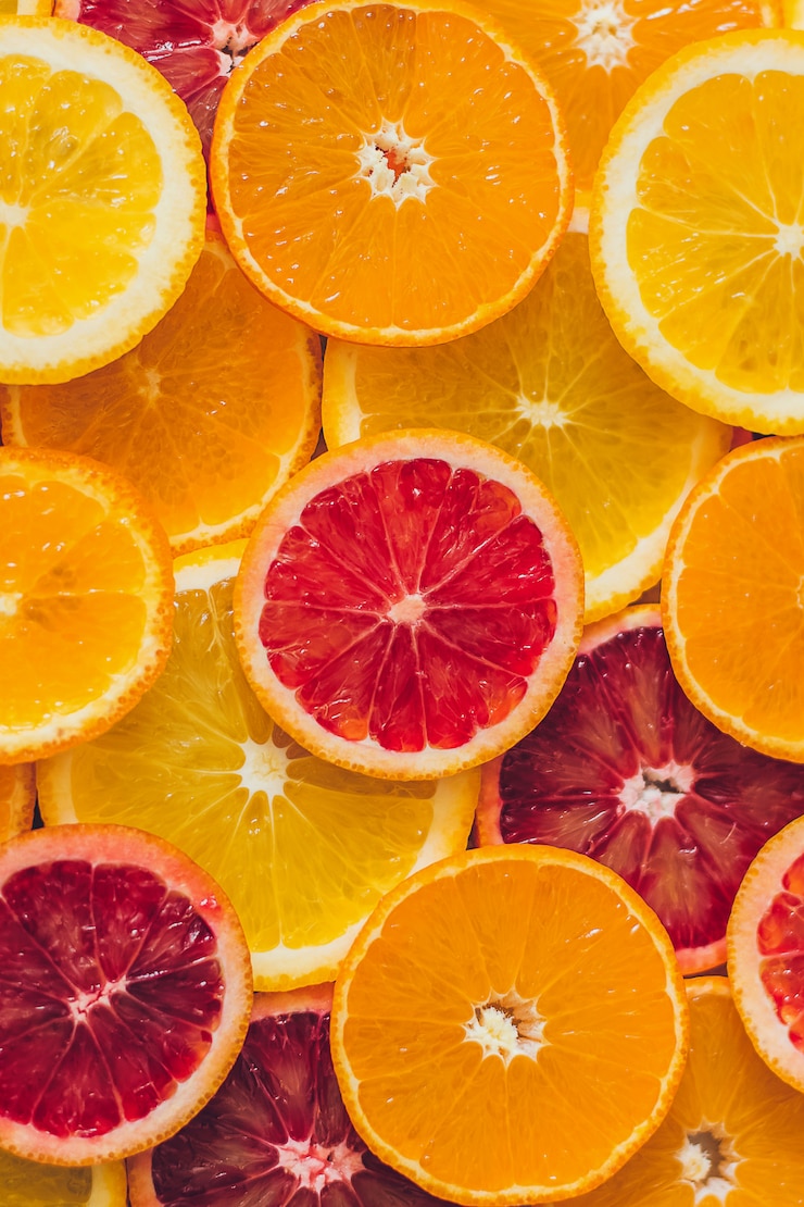 Photo fond d'orange juteuse, de pamplemousses et de citrons