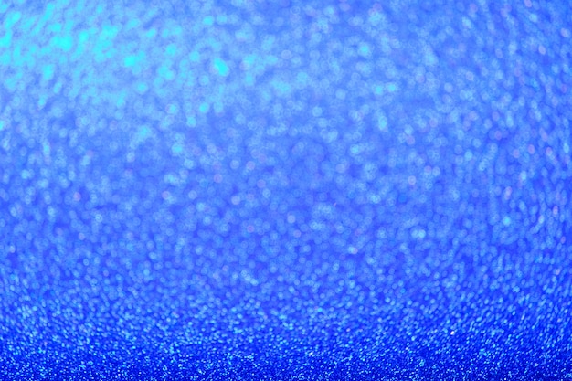 Fond de paillettes bleues défocalisés