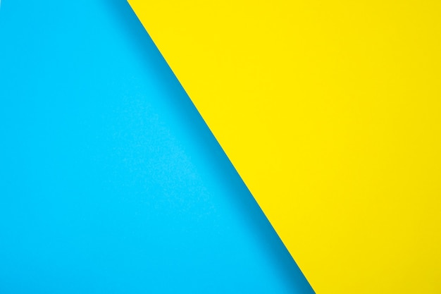 Fond de papier de couleur. couleur vive, bleu et jaune. en diagonale, avec une ombre. Pour la conception, le texte