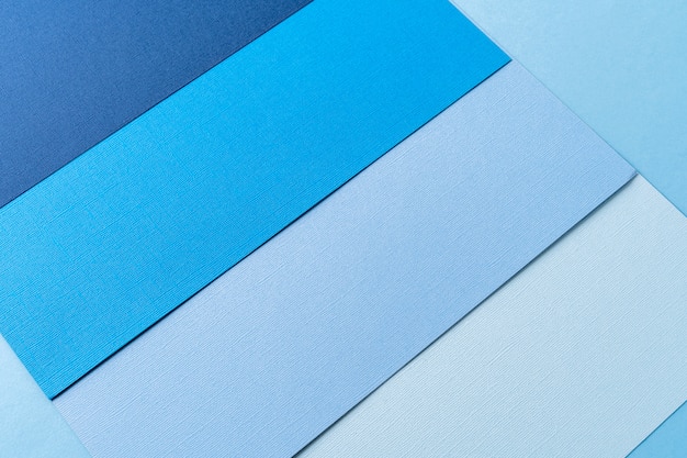 Fond de papier créatif minimal en couleur bleue.