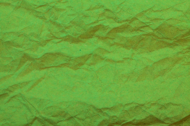 Fond de papier froissé vert.