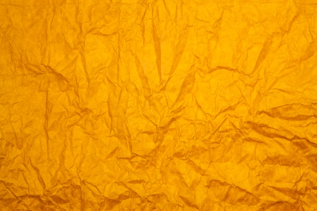 Fond de papier orange texturé.