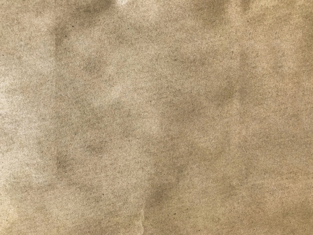 Fond de papier de texture de sac de papier brun foncé.
