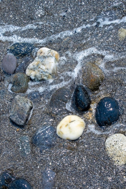 Fond de petites pierres au bord de la plage