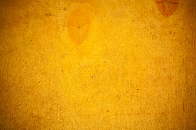 Fond de planche de bois jaune.