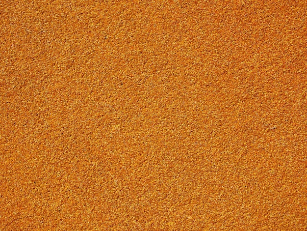 Fond de prairie de gazon synthétique artificiel orange