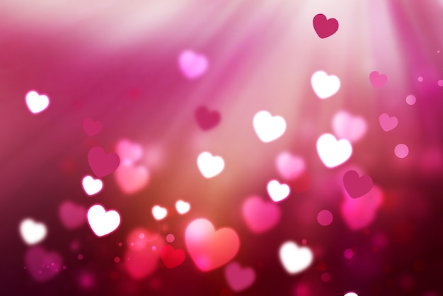 Fond romantique avec des coeurs brillants