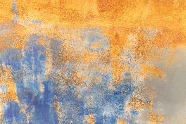 Fond rouillé en métal orange et texture grunge en métal bleu