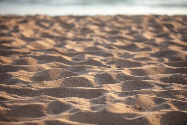 Fond de sable et coucher de soleil. texturé