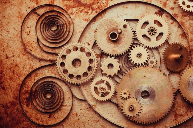 Fond Steampunk à partir de détails d'horloges mécaniques sur fond de métal ancien. A l'intérieur de l'horloge, des engrenages