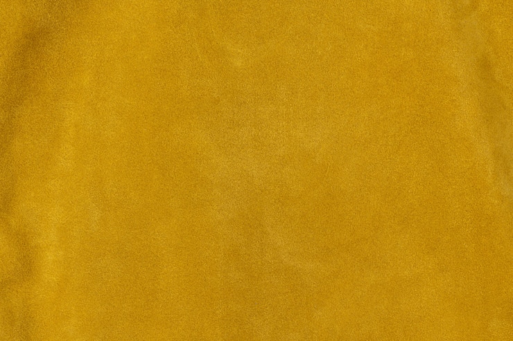 Photo fond de surface en cuir suédé texturé jaune doré safran