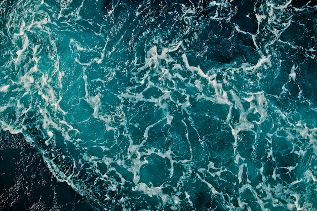 Fond de surface de l'eau de mer aqua