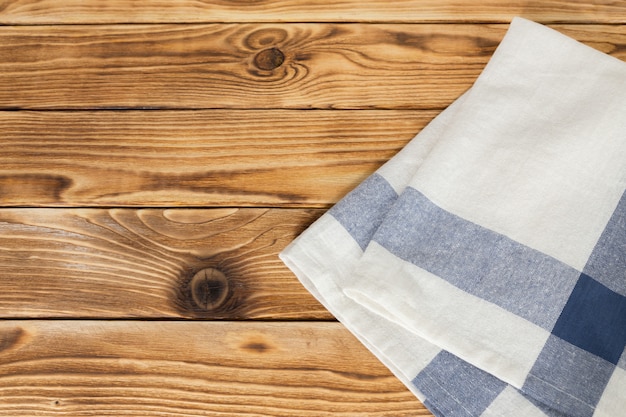 Photo fond avec une table en bois vide avec nappe