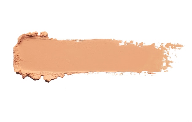 Fond de teint crème de maquillage isolé sur blanc