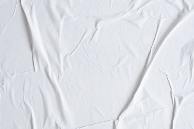 Fond de texture d'affiche de papier froissé et froissé blanc vierge