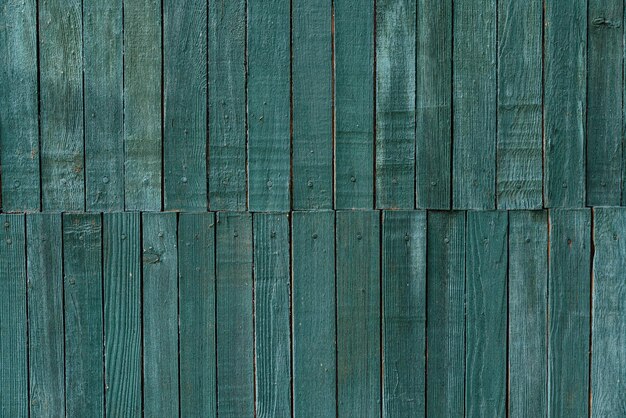 Fond texturé en bois bleu Mur ou clôture en bois avec des planches en zigzag Motif à chevrons sans soudure Photo de haute qualité