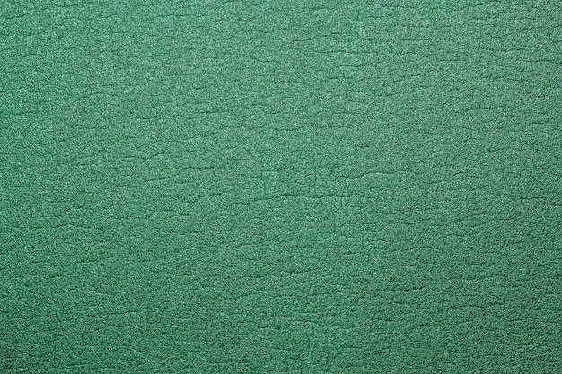 Fond texturé de caoutchouc mousse vert.